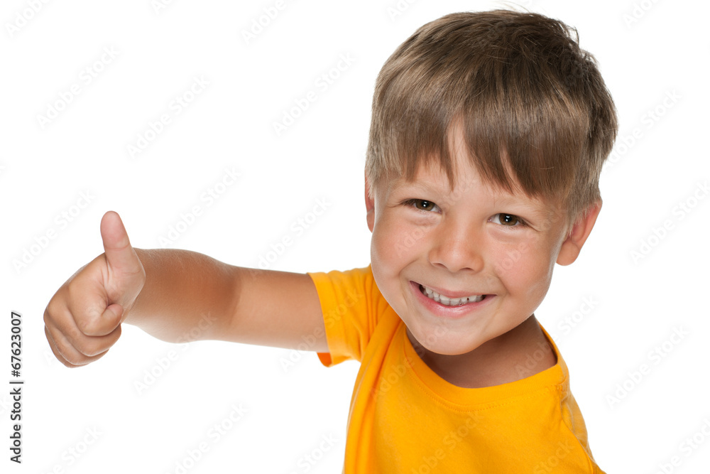 Young happy boy holds his thumb up Young happy boy holds his thumb up