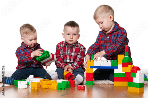 Little boys play with blocks