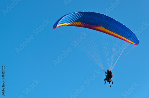 Blue Paraglider in Blue Sky