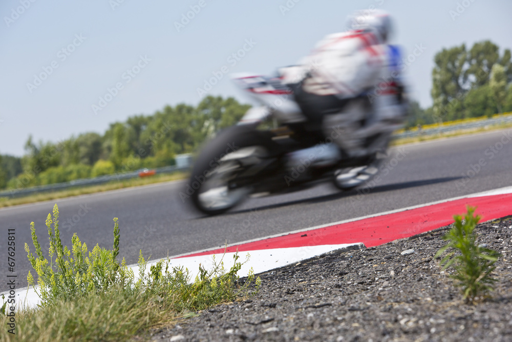 Motorcycle racer on circuit