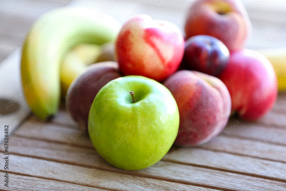 Juicy fruits on wooden table, close-up