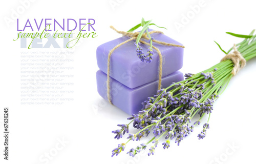 Handmade soap and lavender flowers on a white background