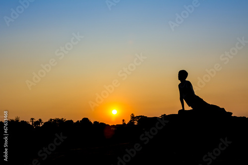Silhouette of a man in Yoga posting © markuso