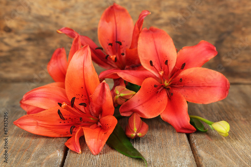Fototapeta Naklejka Na Ścianę i Meble -  Beautiful lily on wooden background