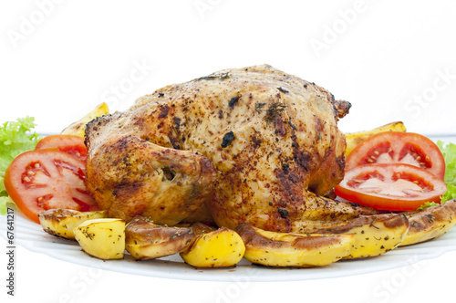 Whole roasted chicken on white background photo