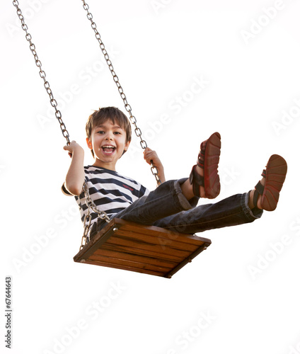 Boy having fun on a swing, on a white background. photo