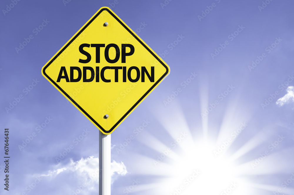 Stop Addiction road sign with sun background Stop Addiction road sign with sun background