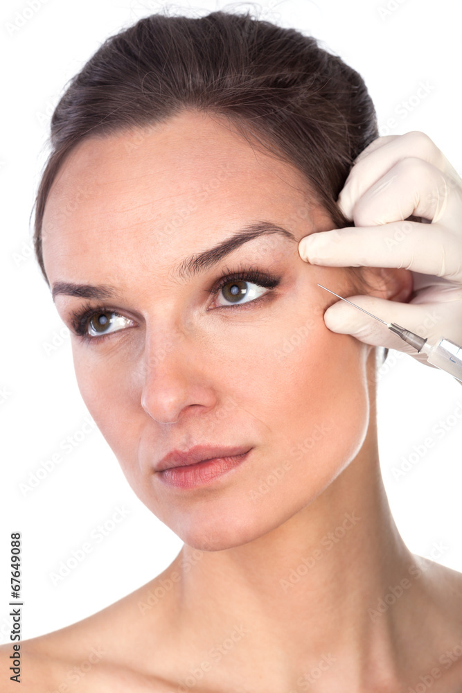 The doctor injects liquid wrinkle preventive woman