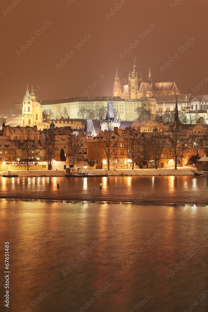 Night snowy Prague gothic Castle with Charles Bridge