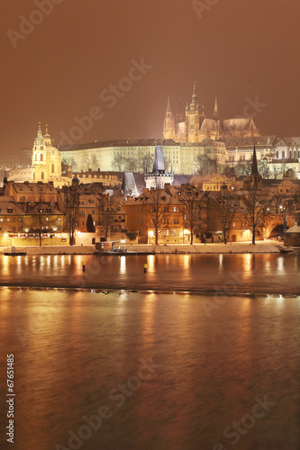 Night snowy Prague gothic Castle with Charles Bridge