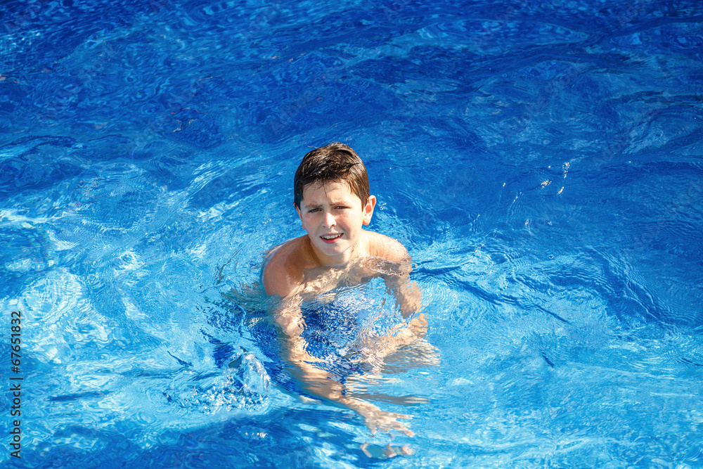 Boy in the swimming pool