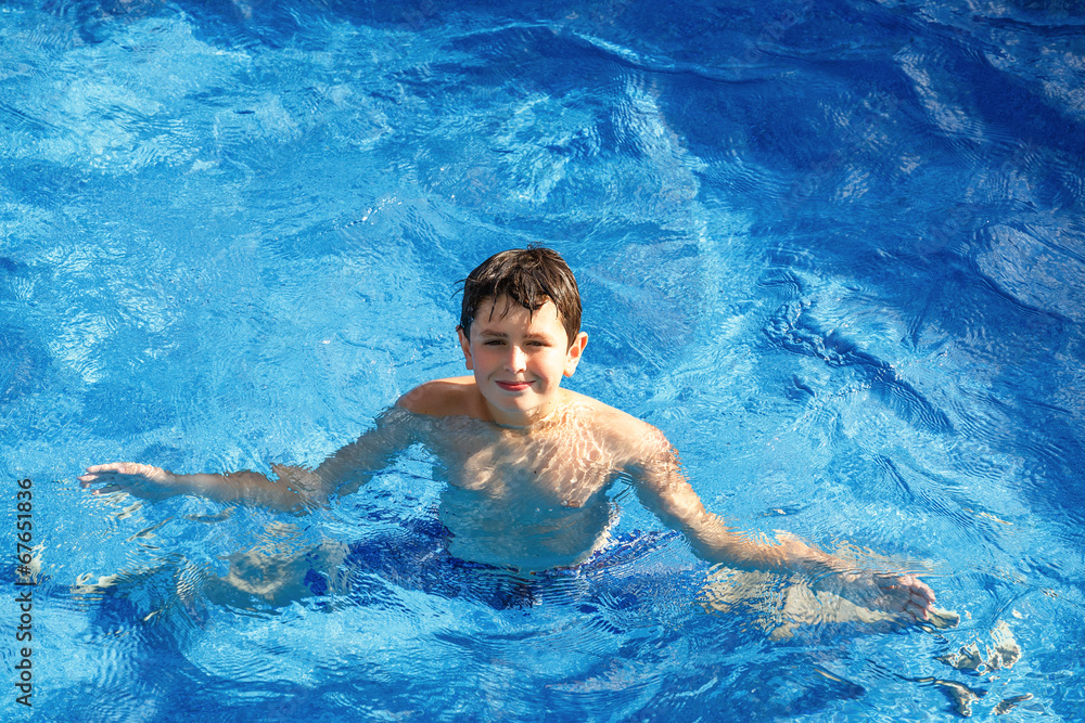 Boy in the swimming pool