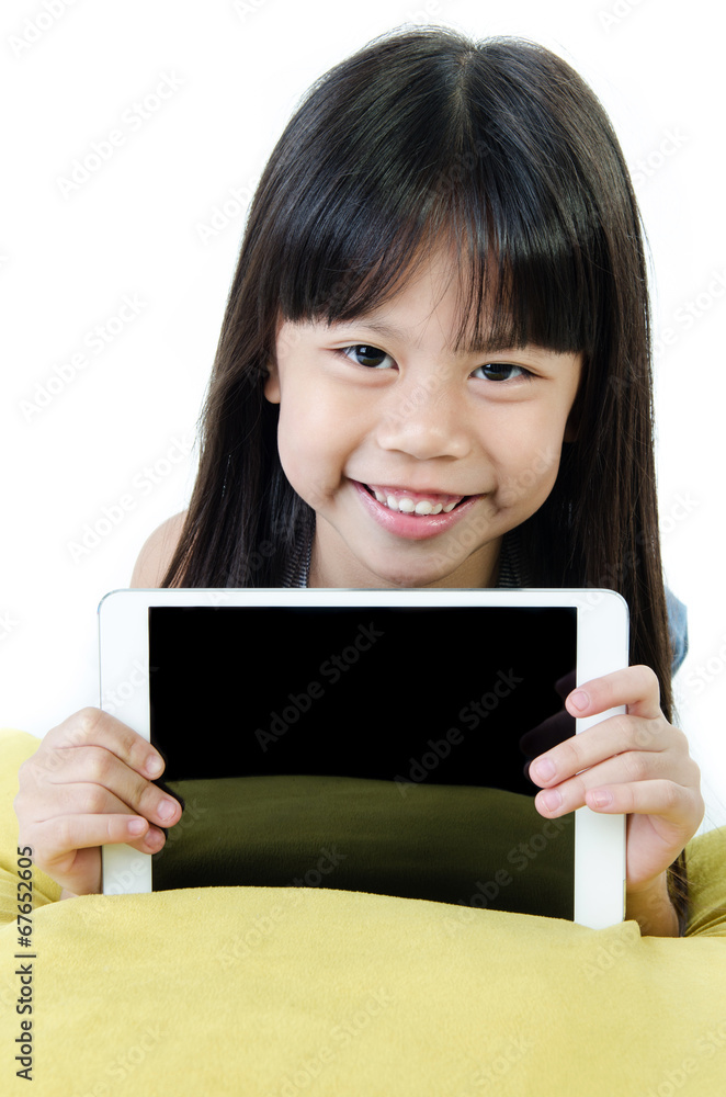 Little asian girl smiles with tablet computer Little asian girl smiles with tablet computer
