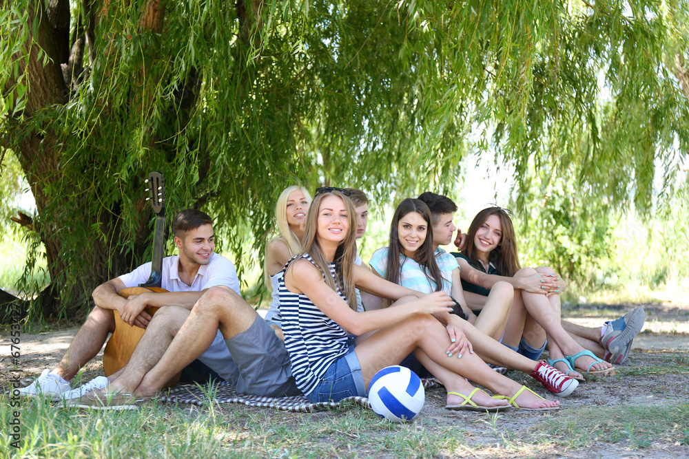 Group of friends having rest at park Group of friends having rest at park