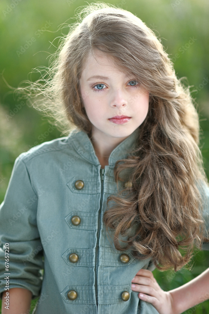 portrait of little girl outdoors in summer portrait of little girl outdoors in summer