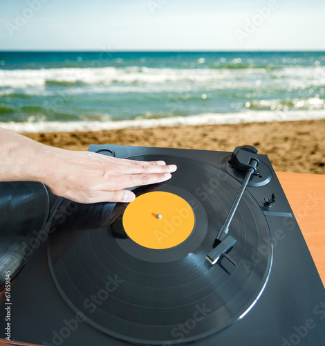 DJ mixing beach photo