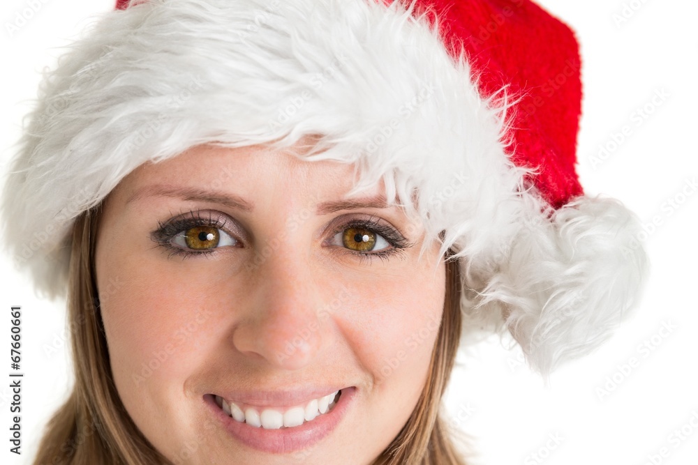 Close up portrait of pretty woman in santa hat