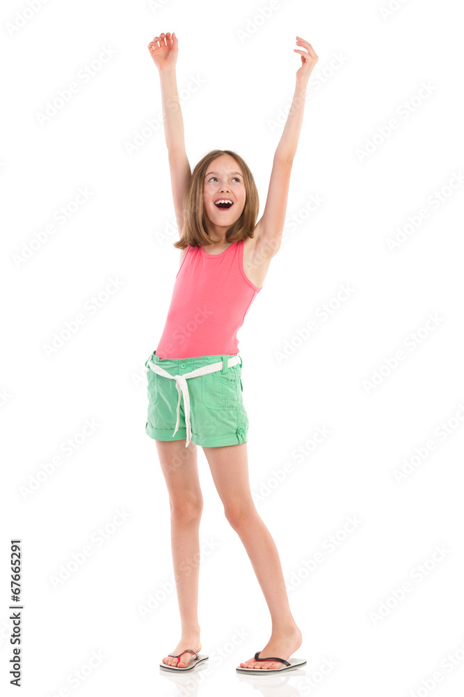 Shouting girl with arms raised