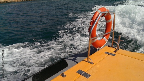 Fast trip on the rescue boat, railings and ring buoy © evannovostro