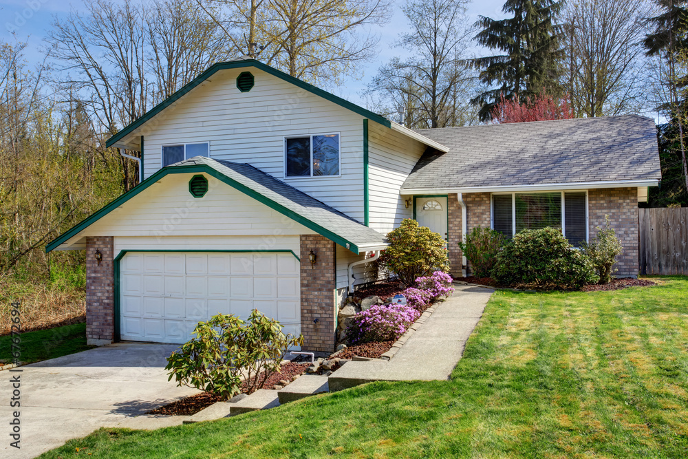 House exterior with brick wall trim House exterior with brick wall trim
