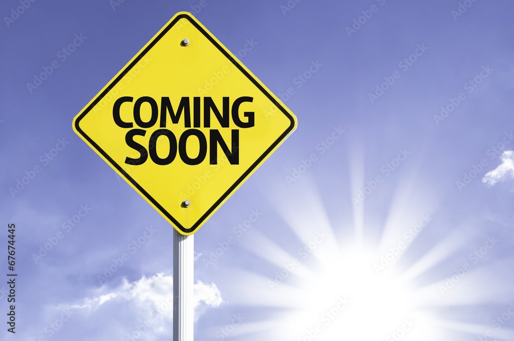 Coming Soon road sign with sun background Coming Soon road sign with sun background