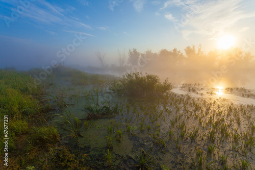 Amazingly beautiful sunrise over Lake, foggy