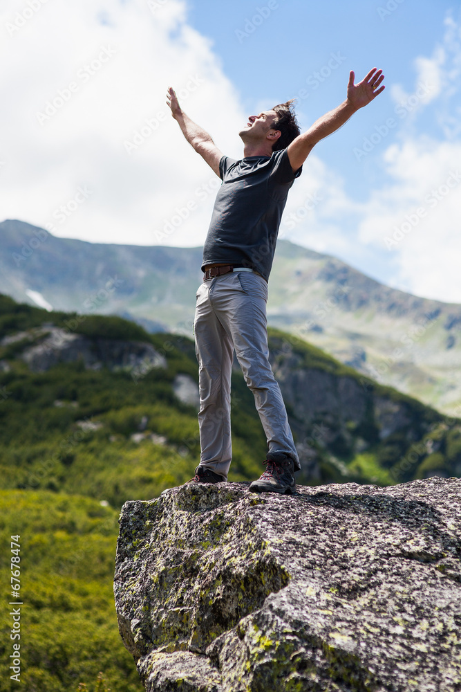 Happy young man in the mountains Happy young man in the mountains