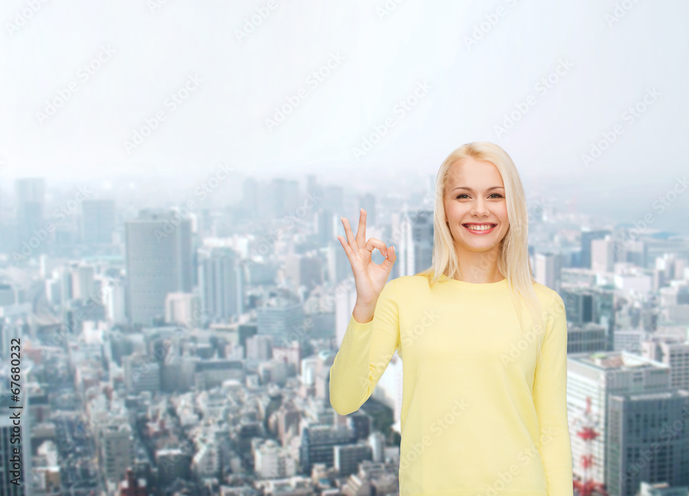 young businesswoman showing ok sign