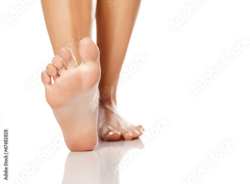 nicely nursed women's feet on white background © vladimirfloyd