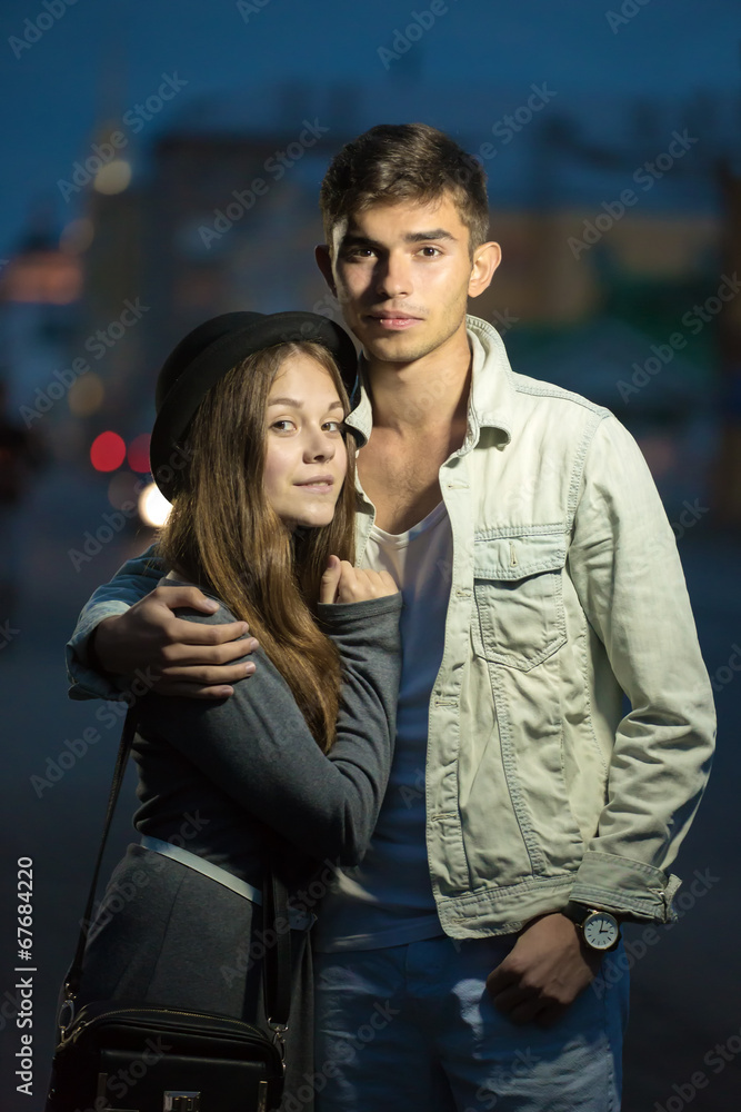 The guy and the girl cost having embraced in the street