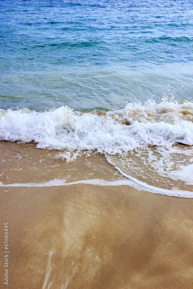 Wave of the sea on the sand beach