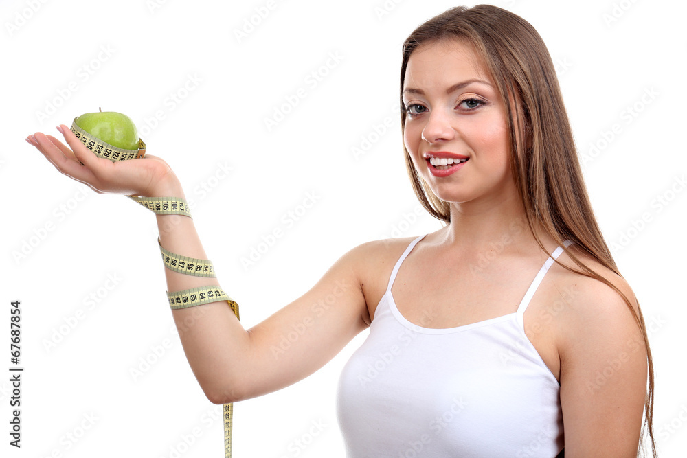 Beautiful girl with apple and measuring tape, isolated on white Beautiful girl with apple and measuring tape, isolated on white