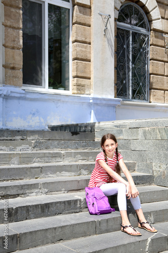 Cute girl with backpack on ...
