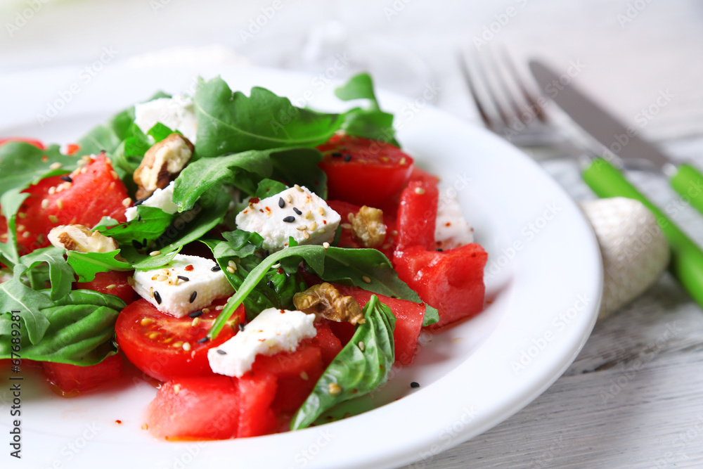 Salad with watermelon, feta, arugula and basil leaves Salad with watermelon, feta, arugula and basil leaves