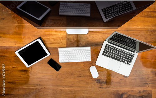 Computer ,laptop , tablet , smart phone on wood table