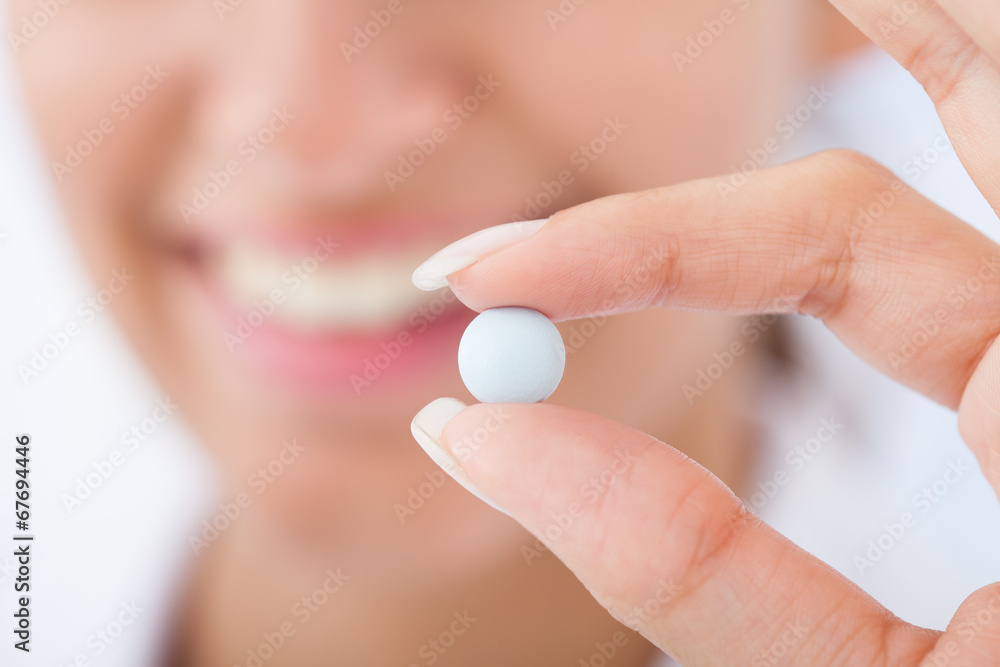 Female Doctor Showing Pill Female Doctor Showing Pill