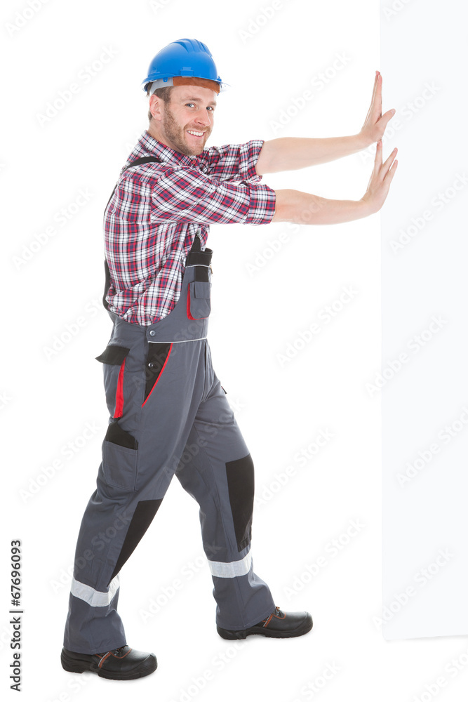 Happy Manual Worker Pushing Billboard Happy Manual Worker Pushing Billboard