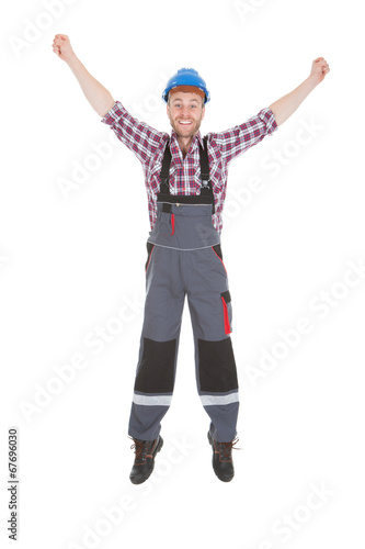 Manual Worker Screaming With Hands Raised