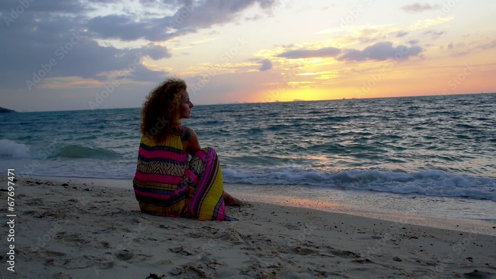 Beautiful Woman with Tattoo and Curly Hair Enjoys Sunset. Slow Beautiful Woman with Tattoo and Curly Hair Enjoys Sunset. Slow