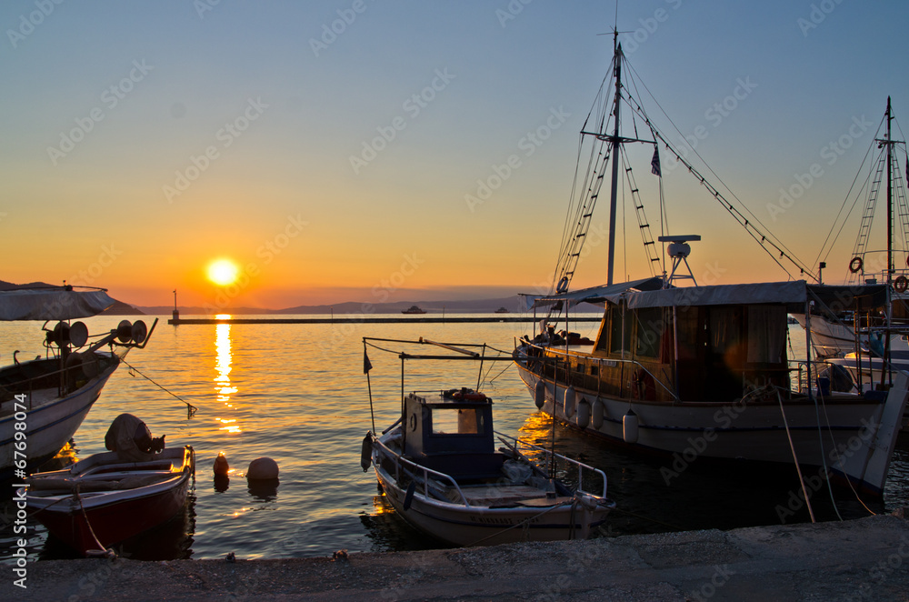 Fishing boats in Limenas harbour at sunset, island of Thassos