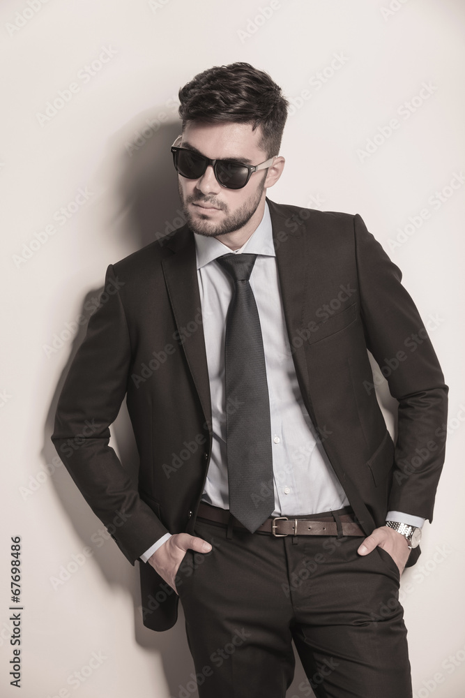 fashion model in suit and tie looking cool fashion model in suit and tie looking cool