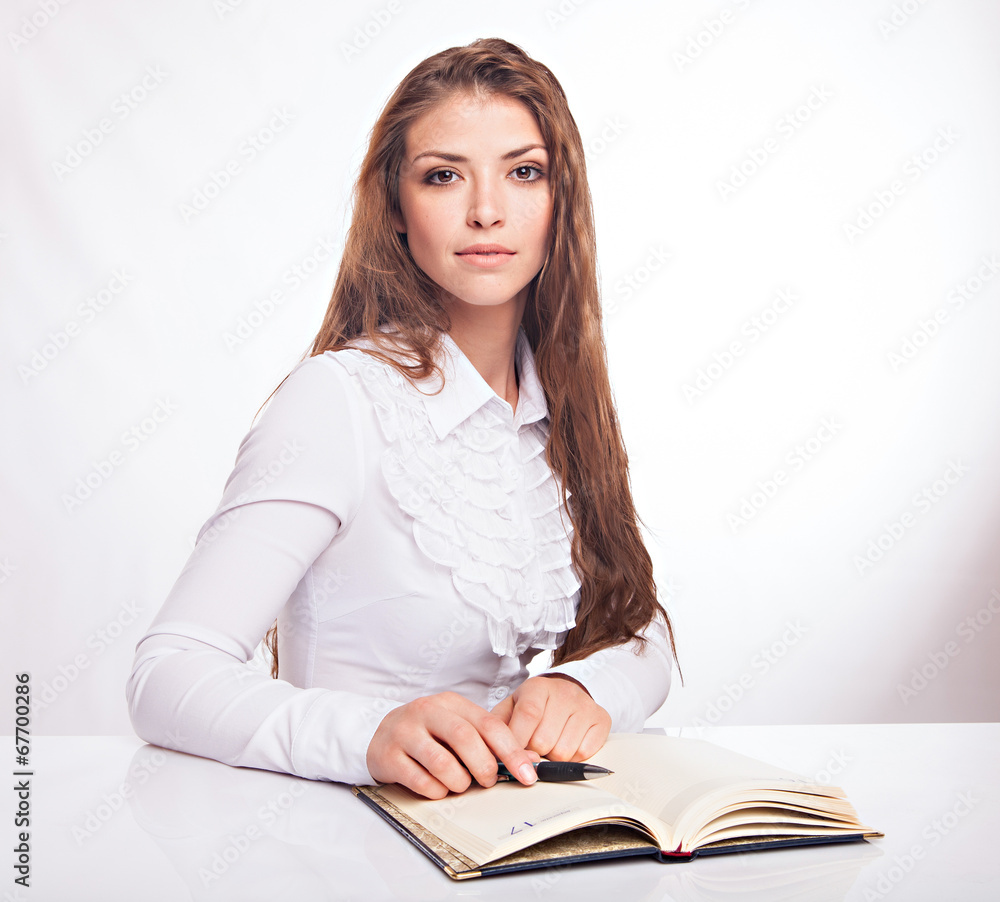 Portrait of a young female entrepreneur taking notes Portrait of a young female entrepreneur taking notes