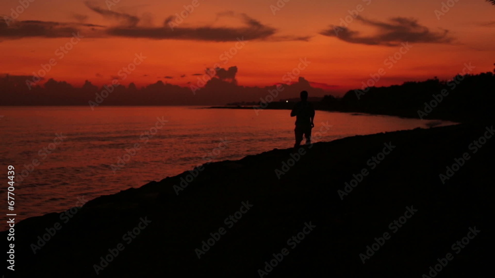 Man jogging at the evening next to seaside Man jogging at the evening next to seaside