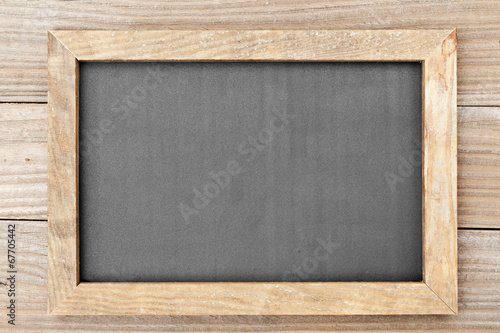 Clean chalkboard on wooden table