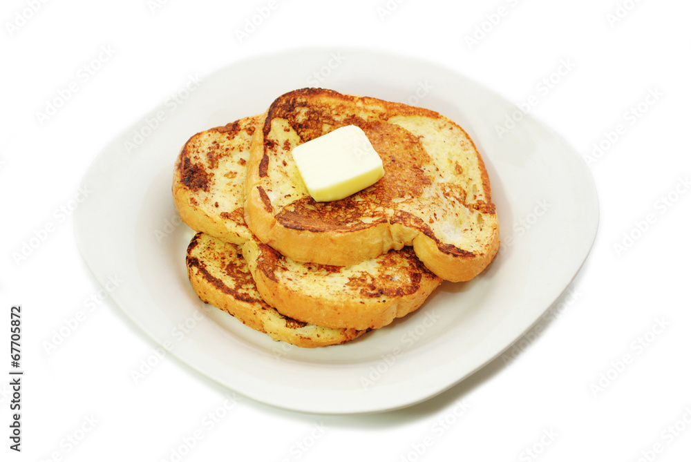 Fried French Toast served on a Plate with Butter Fried French Toast served on a Plate with Butter