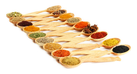 Fototapete Gewürze Assortment of spices in wooden spoons, isolated on white  © Africa Studio