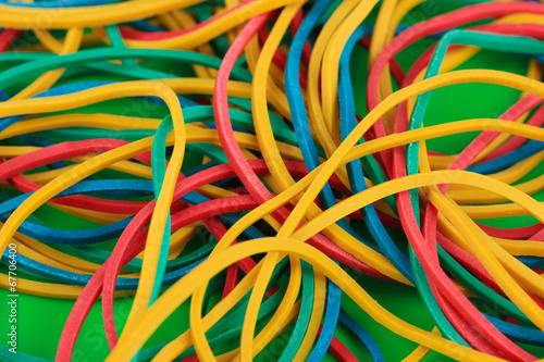 Wallpaper Mural Colorful rubber bands on green background close-up Torontodigital.ca