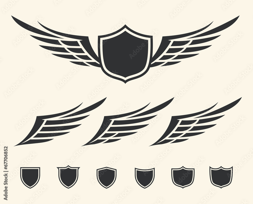 Obraz premium Vector set of isolated winged crests over white background.