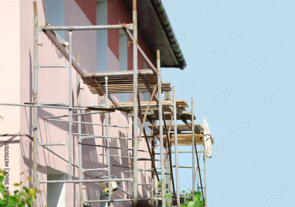 Construction of building of new two-story  house with stairs