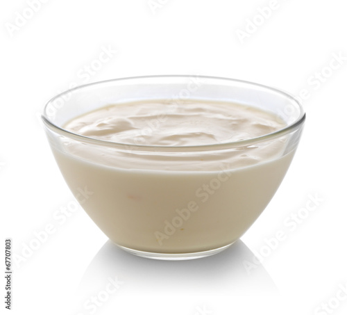 Glass bowl of yogurt isolated on white